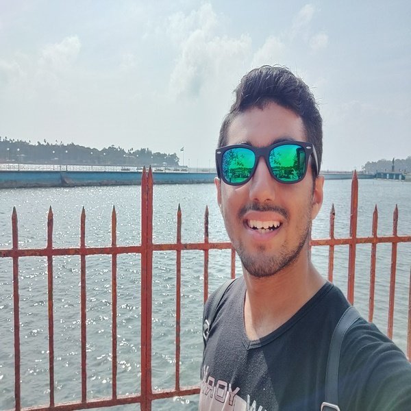 Saurish Monga outdoors wearing sunglasses